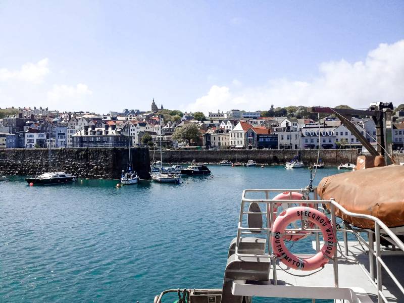 Boats in a harbor in Guernsey, one of the most underrated countries in Europe
