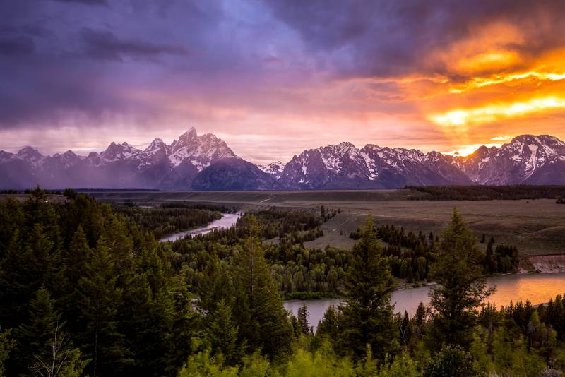 The Grand Tetons at sunset, as seen from the Snake River on one of the Jackon Hole float trips