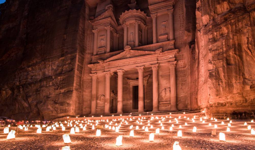Hundreds of candles on the ground in front of a building in Petra, Jordan, one of the most underrated countries to visit