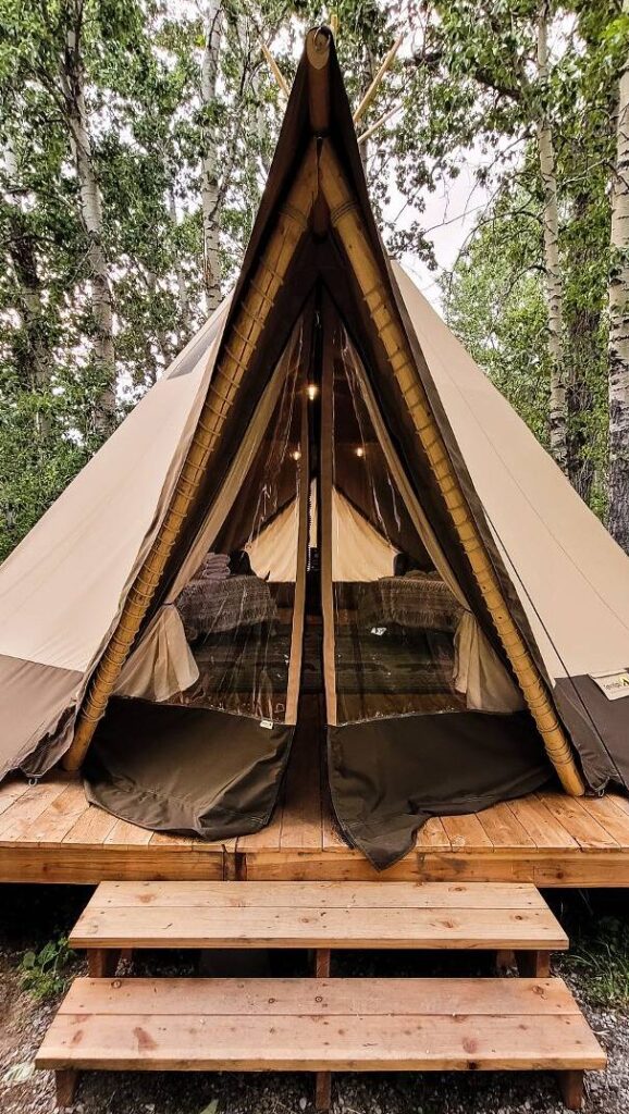The exterior of a tipi at Bodhi Farms, a place you can go glamping in Montana near Yellowstone National Park