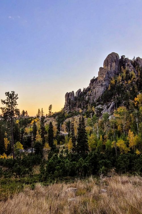 Rock formations with fall foliage at sunset in Custer State Park, one of South Dakota's Great 8
