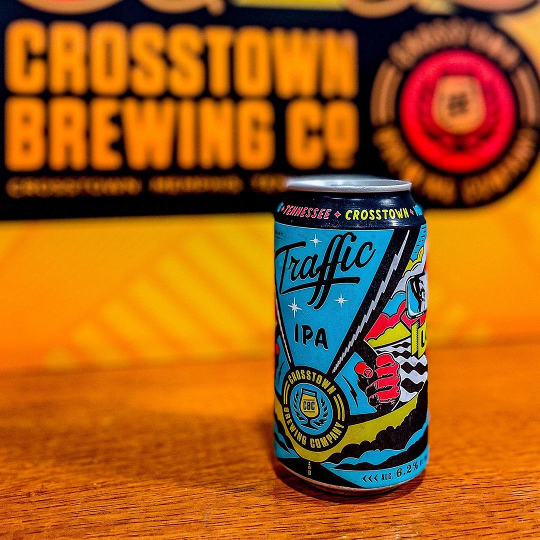 A blue can of Traffic IPA in front of a sign for Crosstown Brewing Co., a local favorite Memphis brewery