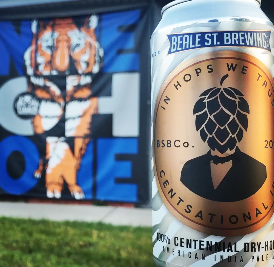 A can of Centsational IPA from Beale St. Brewing, one of the best Memphis breweries, in front of a University of Memphis mural