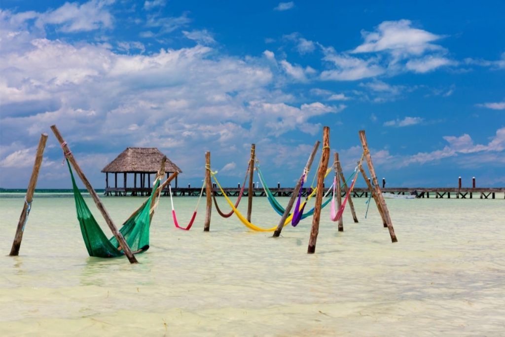 Hammocks in the water at Punta Cocos Beach on Isla Holbox, one of the best places to see bioluminescence