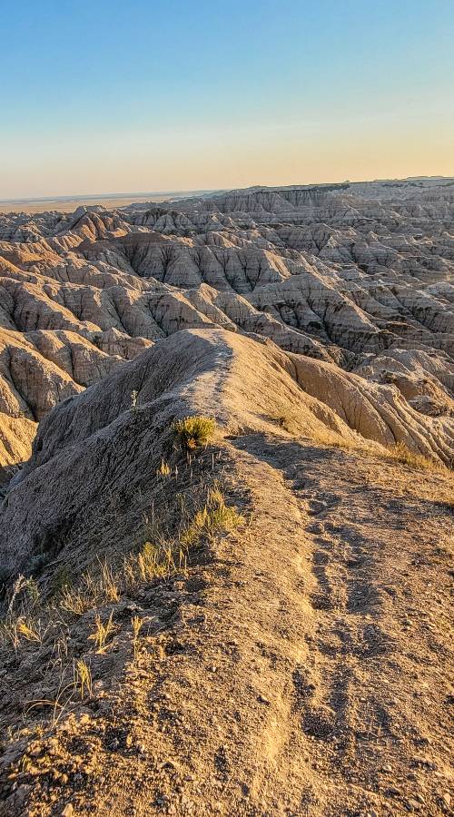 A faint trail on a ridge in Sage Creek Wilderness, one of the best hikes in the Badlands