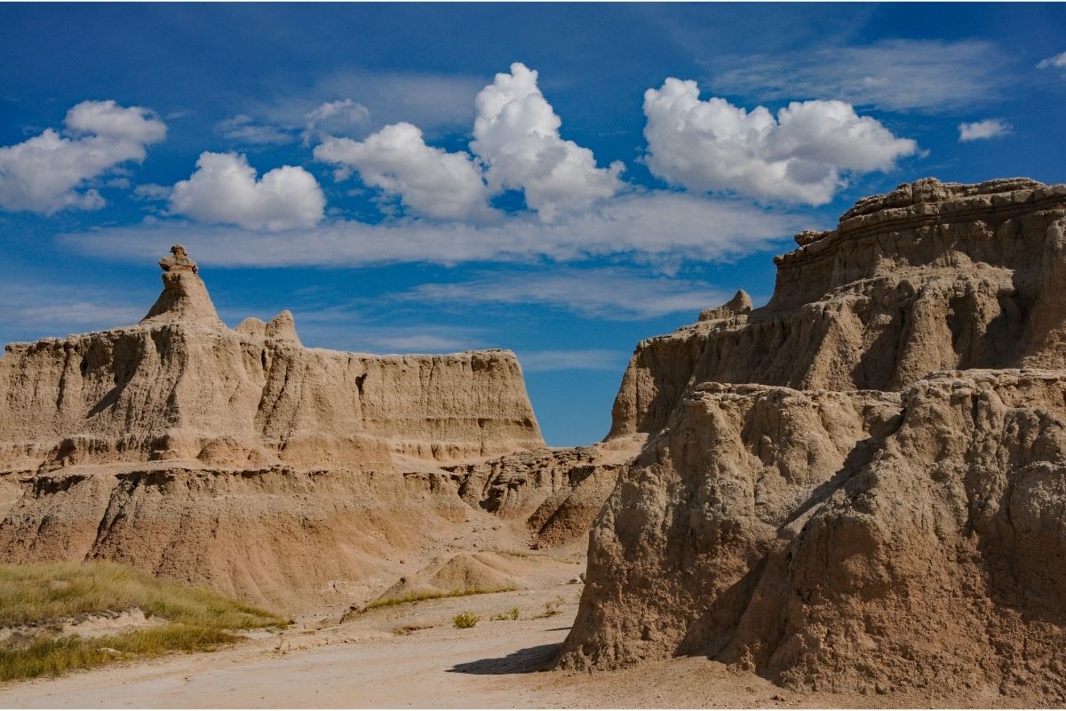 A path between towering canyon walls on the Castle Trail, one of the longest hikes in Badlands National Park