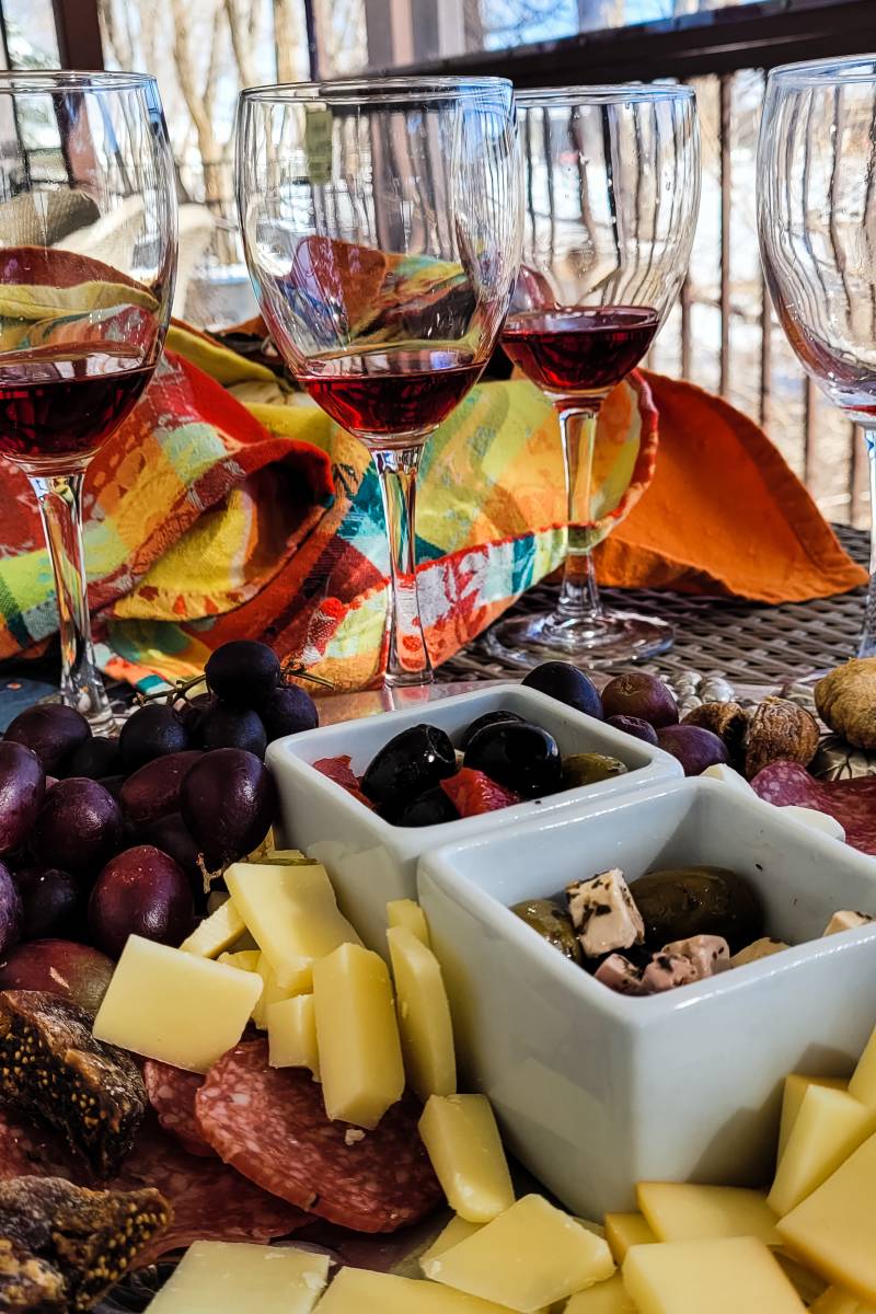 Wine glasses and charcuterie at the Winery at Holy Cross Abbey, one of the best things to do near the Royal Gorge Colorado