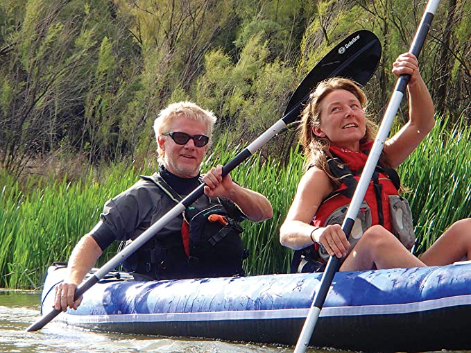 Two people paddling in a Solstice Durango inflatable tandem kayak