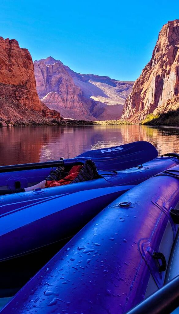 Two blue kayaks side-by-side as they kayak Horseshoe Bend