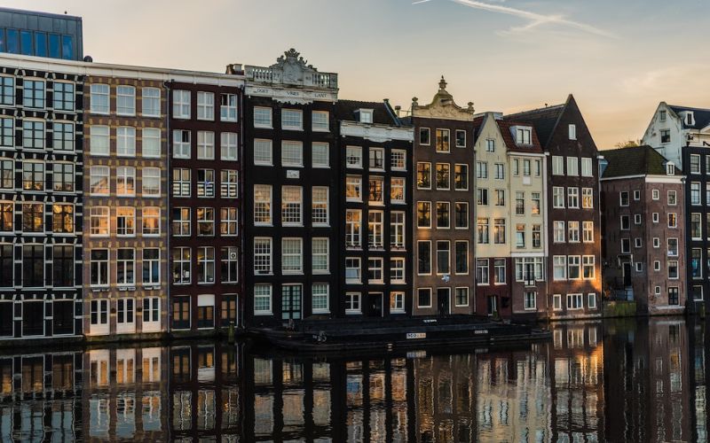 Canal buildings in Amsterdam, one of the best places to travel with friends
