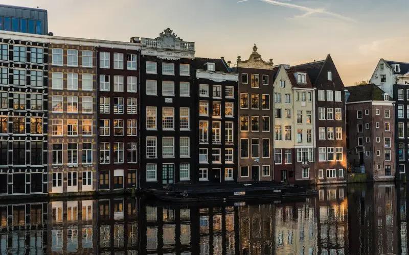Canal buildings in Amsterdam, one of the best places to travel with friends