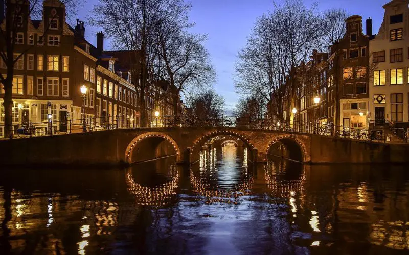 A bridge over a canal in Amsterdam, one of the best places to travel with friends