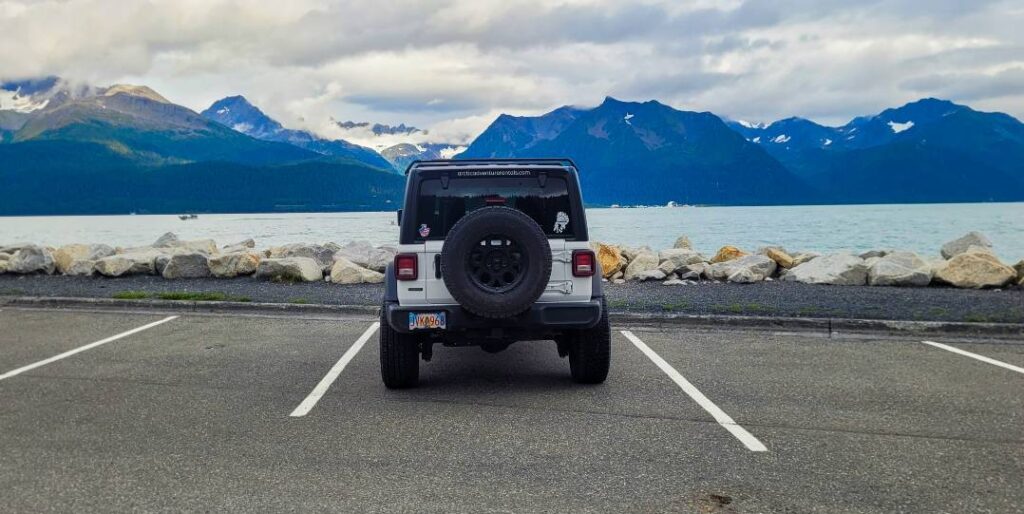 A Jeep parked at the waterfront in Seward Alaska