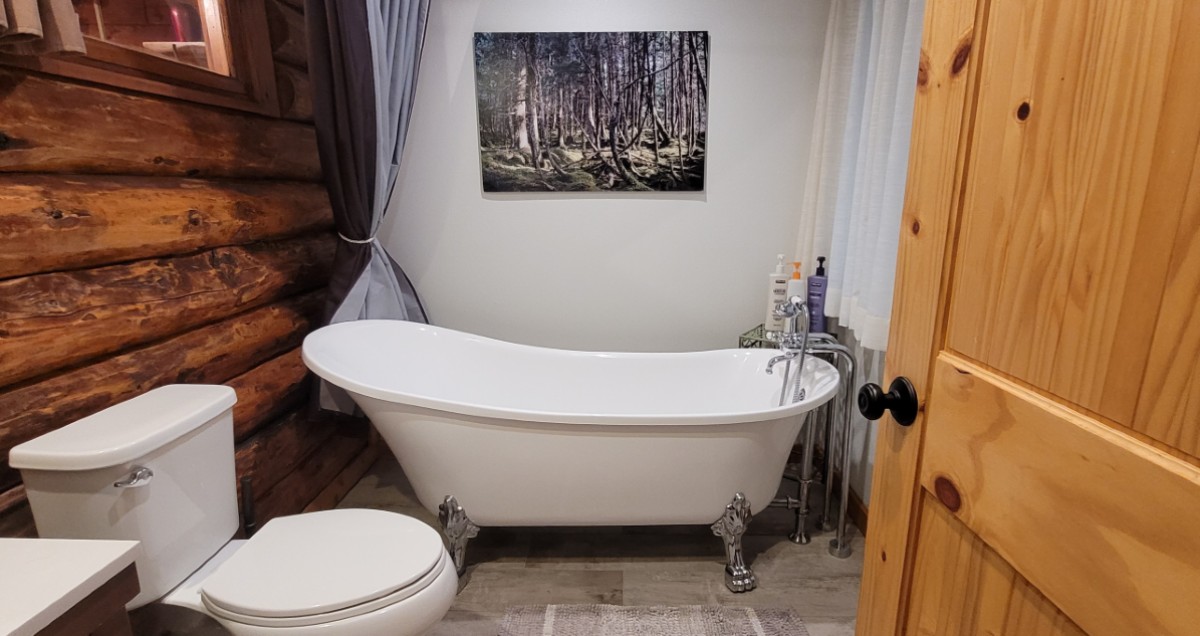 view of claw foot tub in bathroom at alyeska hideaway cabins