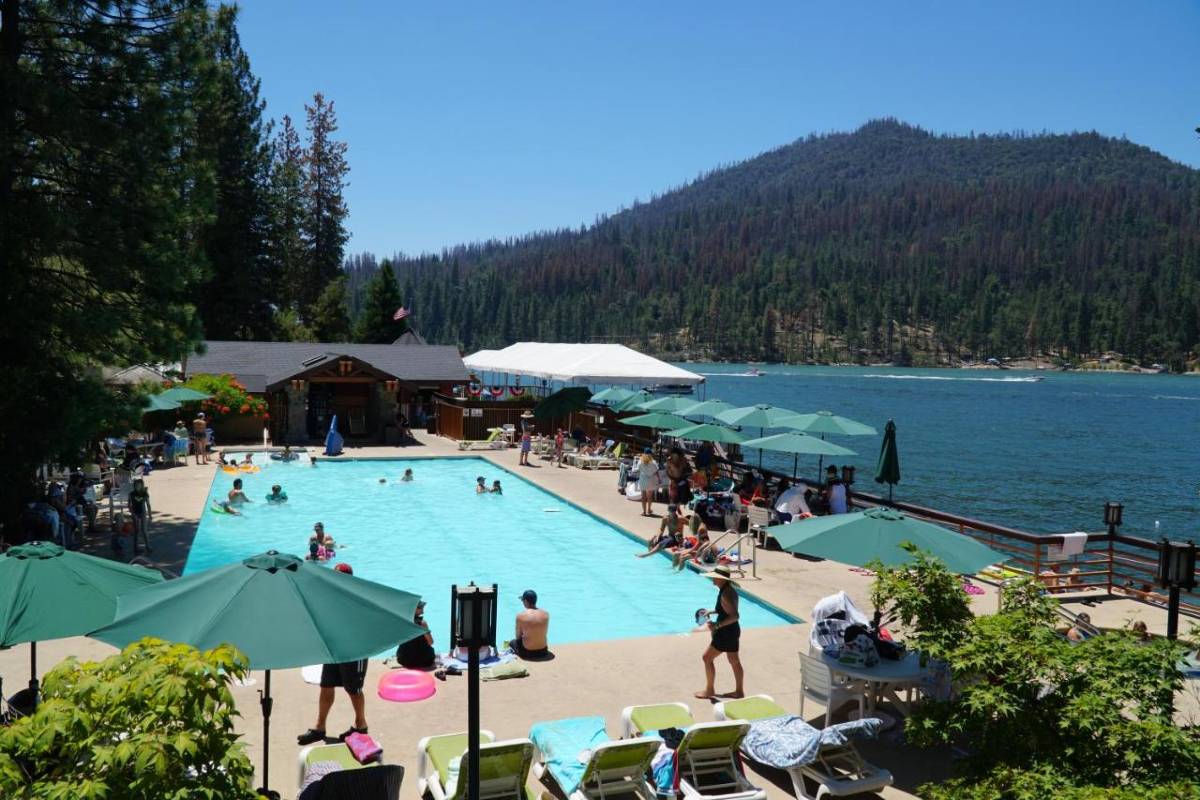 view of the pool area at resort along bass lake near the half dome