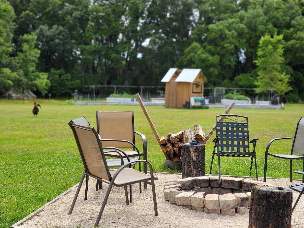 view of the outdoor fire ring and chairs at Kokomo Farms