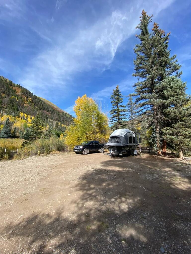view of truck and camper at campsite near telluride