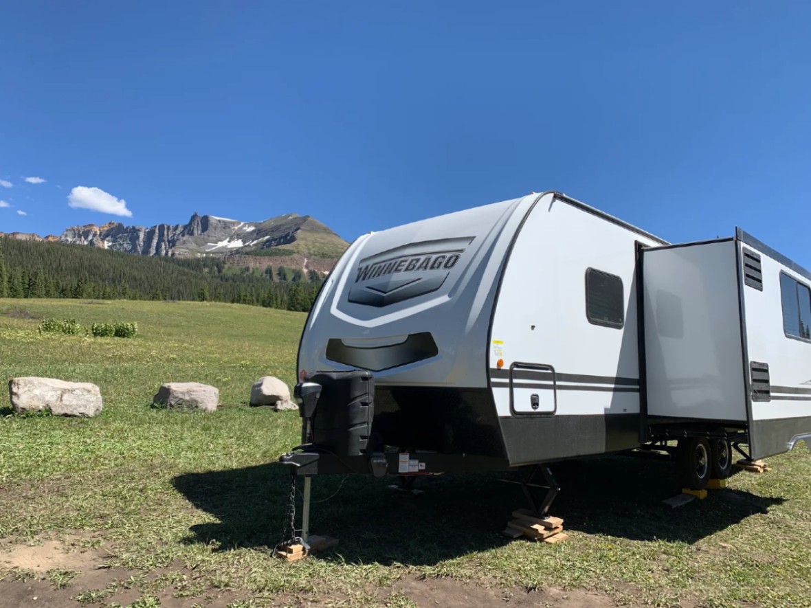 open field with camper set up at campsite near telluride
