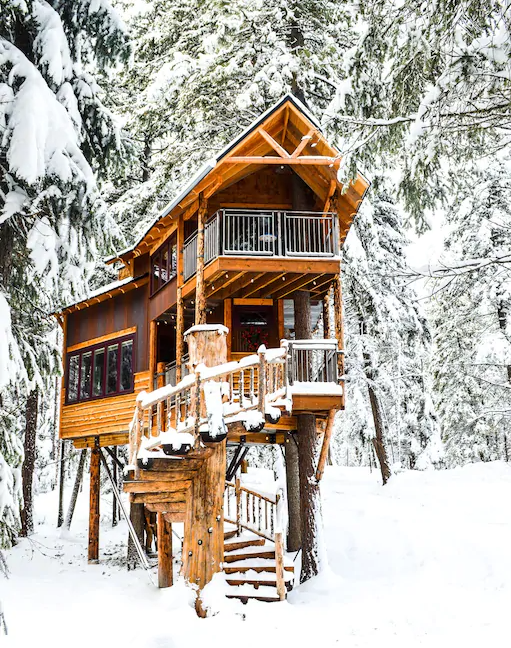 The original Montana Treehouse covered in snow