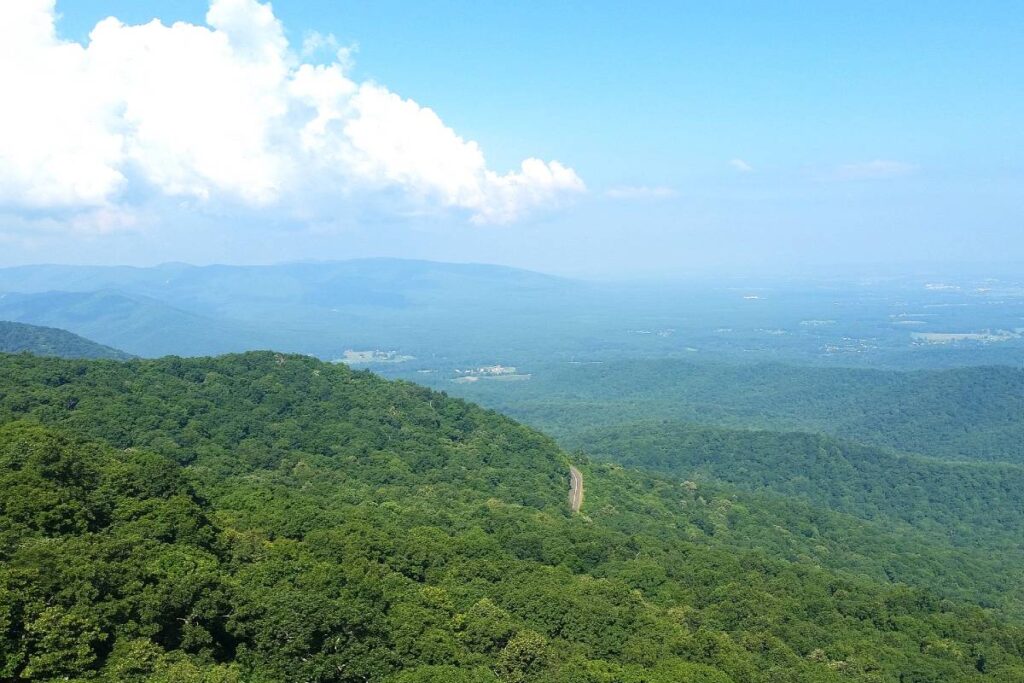 Green hills and a sliver of road as seen from Humpback Rocks, one of the best East Coast hikes
