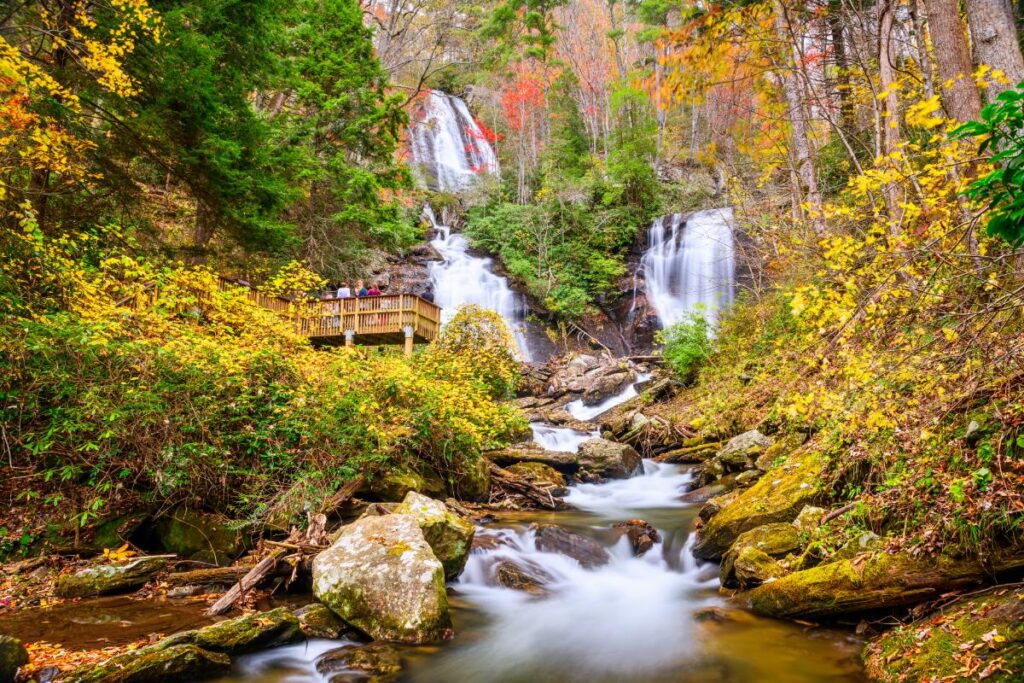 The multiple tiers of Anna Ruby Falls surrounded by fall colors