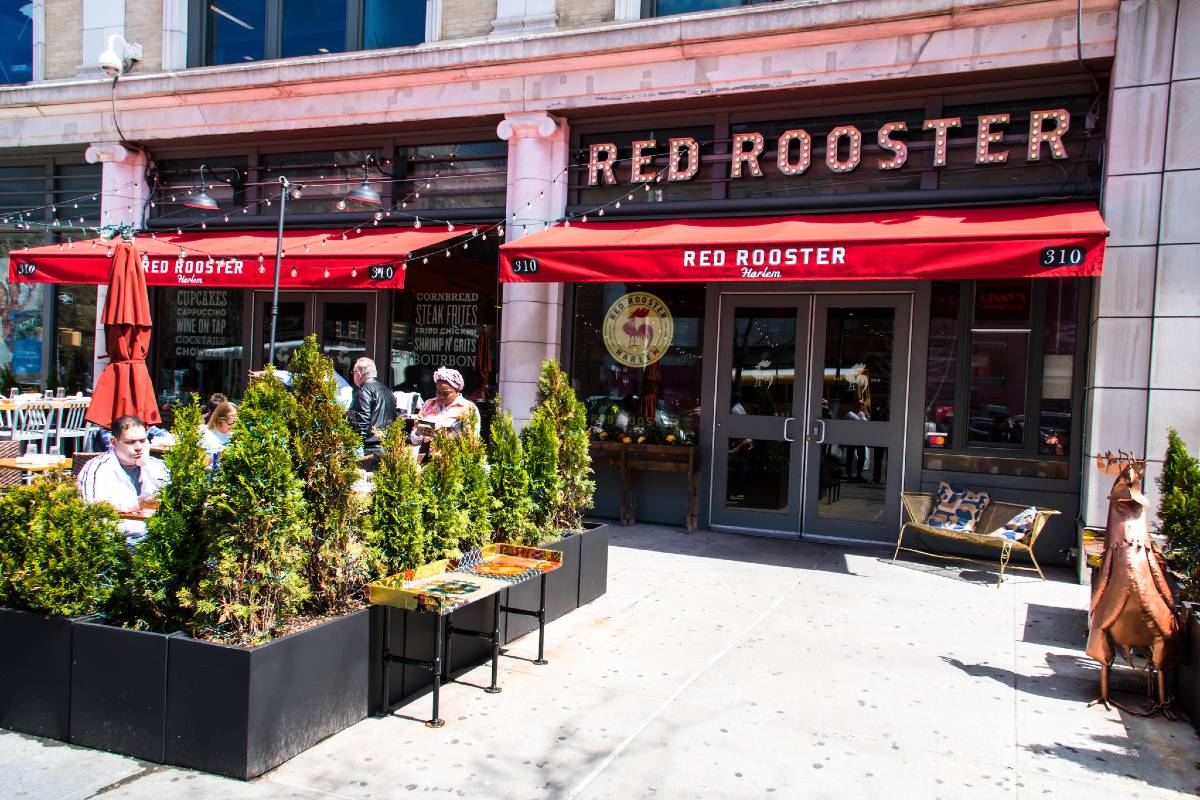 The exterior of Red Rooster, a Harlem restaurant that makes frequent appearances on the average NYC foodie bucket list