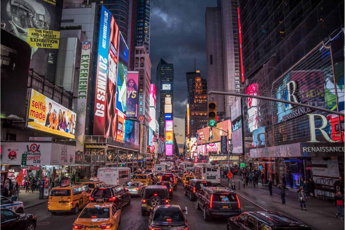 A nighttime scene in Times Square, one of the most popular bucket list things to do in New York