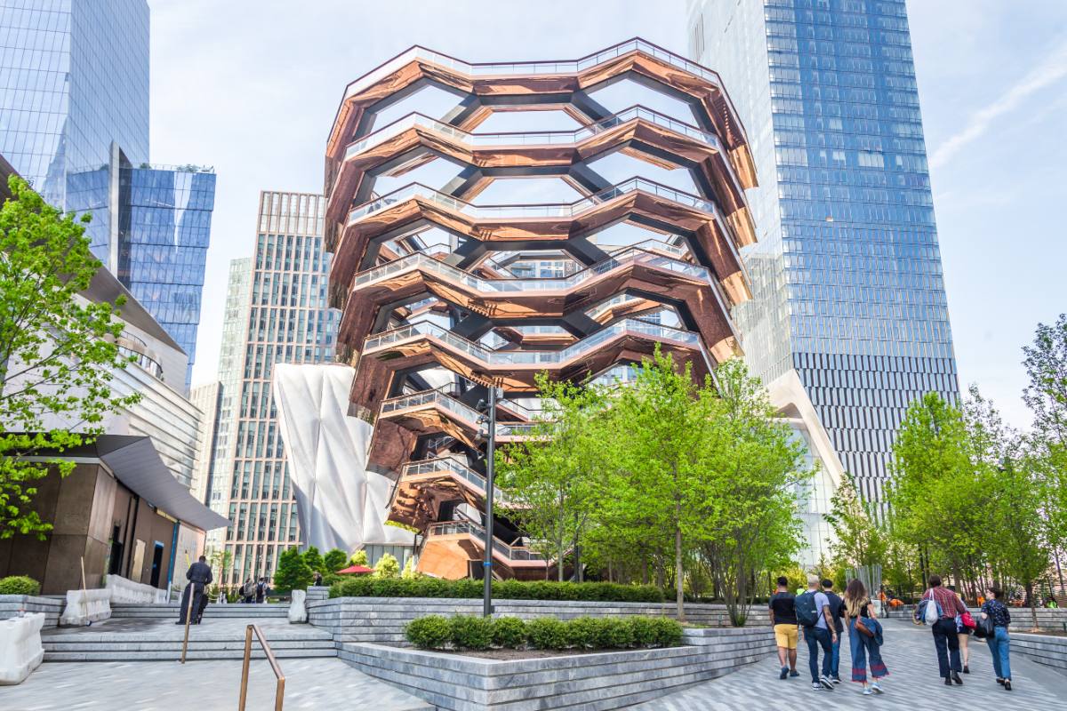 Vessel, a controversial NYC art installation in Hudson Yards, surrounded by several skyscrapers